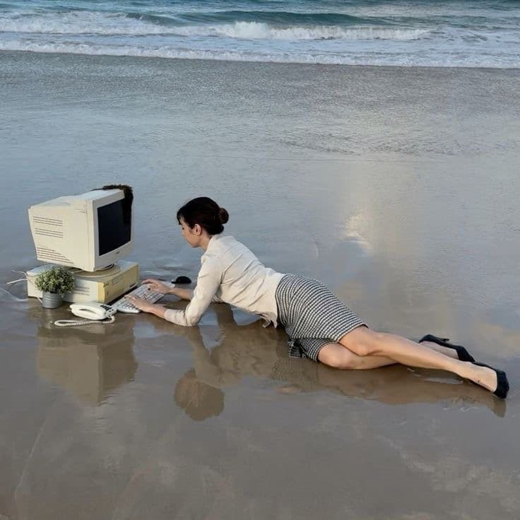 Working on a computer at the beach